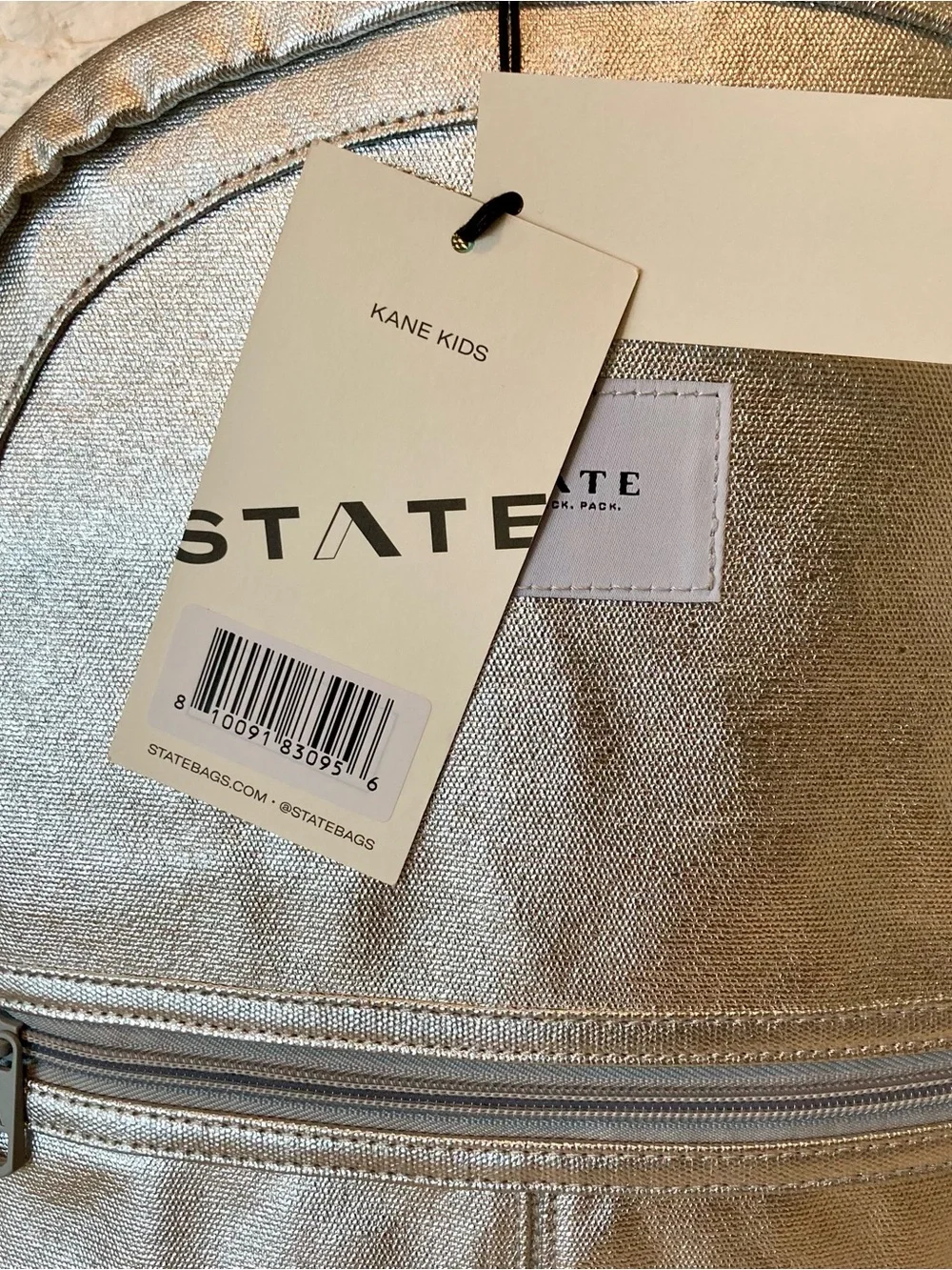 NWT STATE Bags Kane Kids Backpack in a shimmering silver metallic color